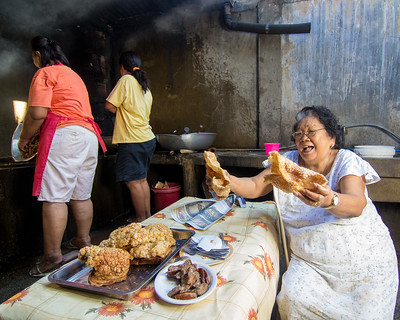 Lady selling dried chicharon 